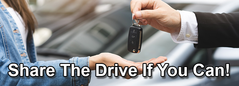 Share the drive if you can showing a man passing the car keys to a lady